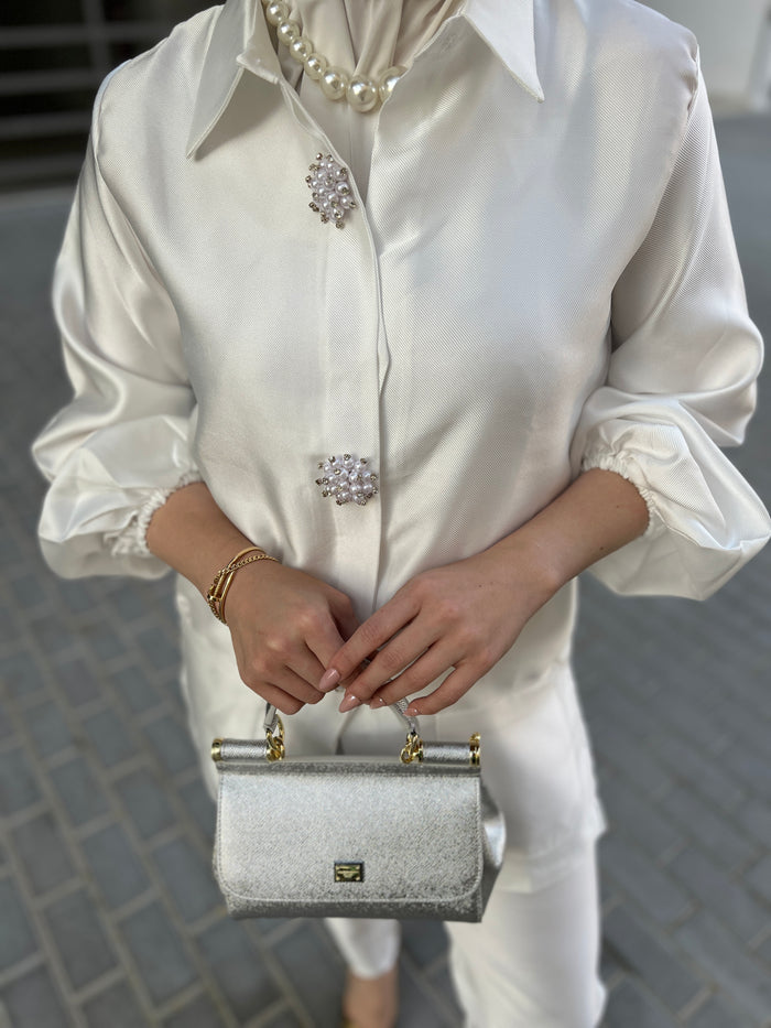 White elegant brooch details suit